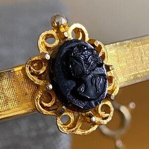 Vintage Gold-Tone Hinged Bangle Bracelet with Black Cameo & Safety Chain